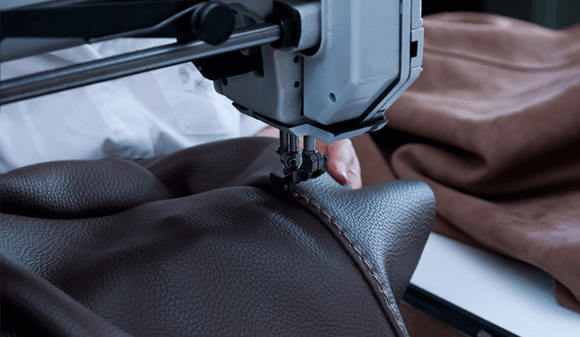 Chateaux d’Ax leather being stitched in the factory